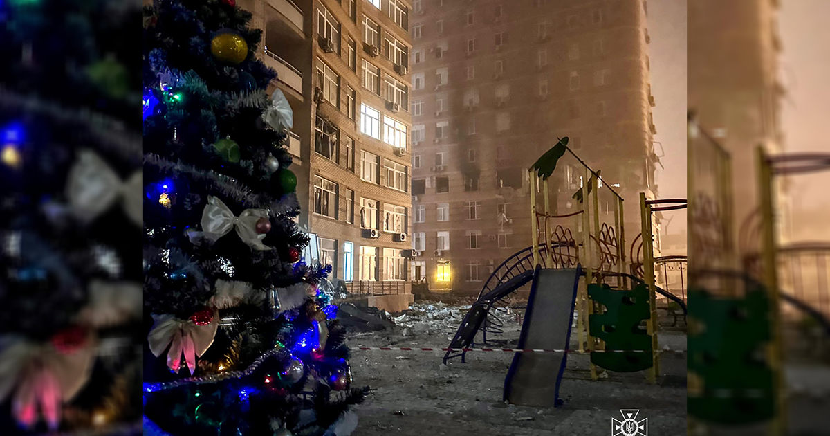 In the yard of a high-rise building damaged by Russian shelling in Odesa, a garland was lit on a Christmas tree.  PHOTO